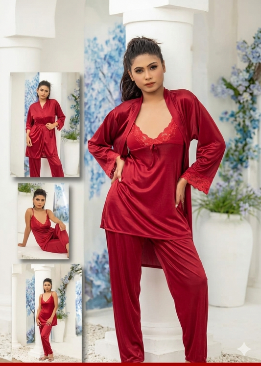 Woman wearing a red satin pajama set with matching robe in a decorated room.