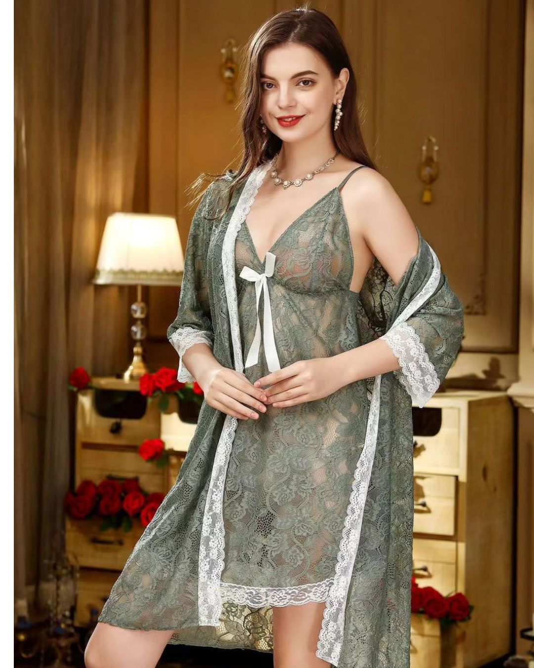 Woman wearing a green lace robe in a cozy room with warm lighting.