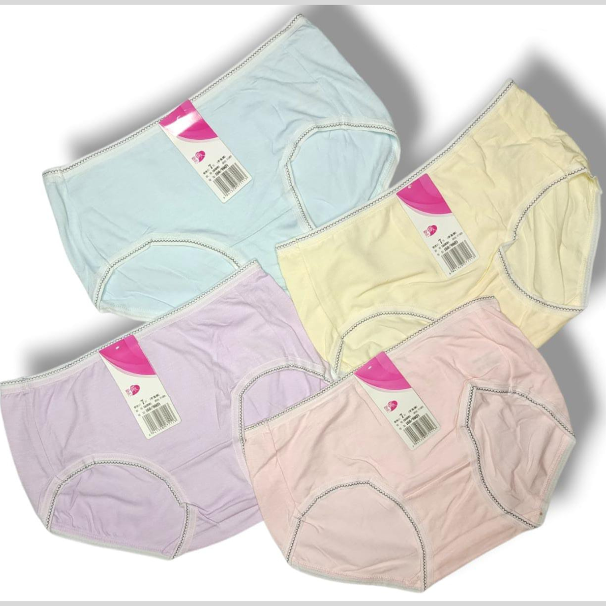 Four pairs of pastel-colored underwear with tags on a white background