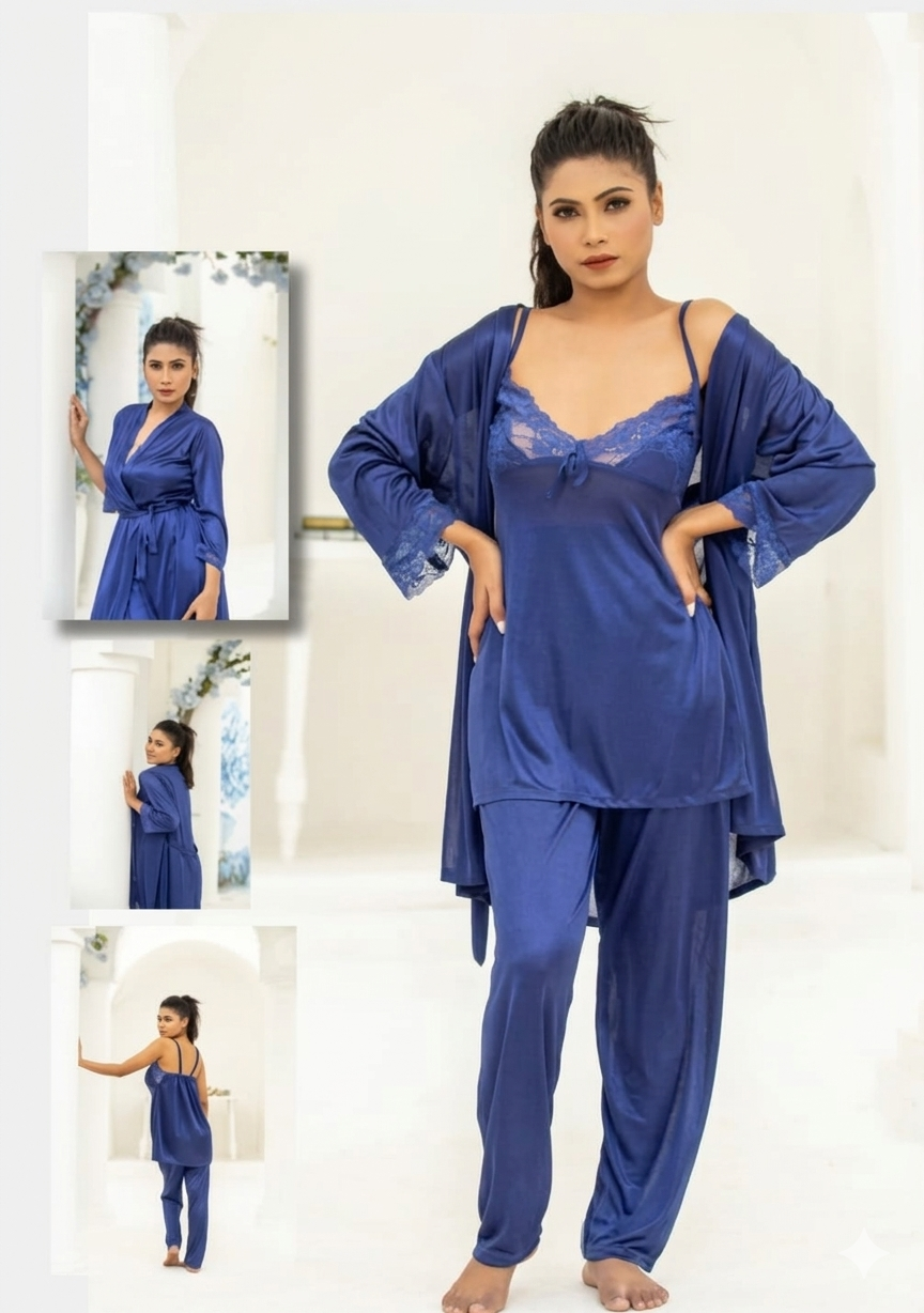 Woman wearing a blue satin nightgown with matching robe in a white room.