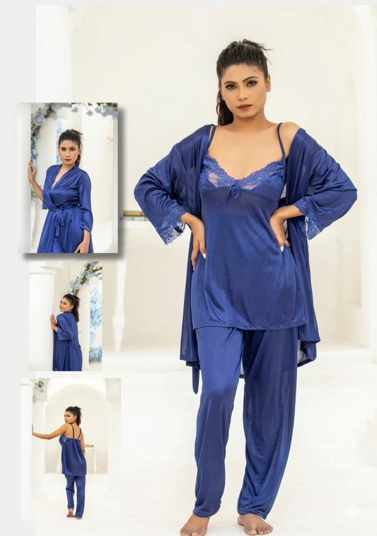 Woman wearing a blue satin nightgown with matching robe in a white room.