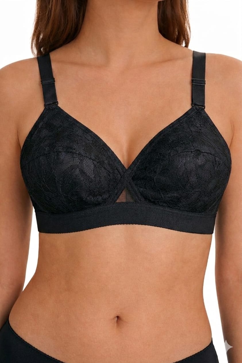 Black lace bra on a model against a white background