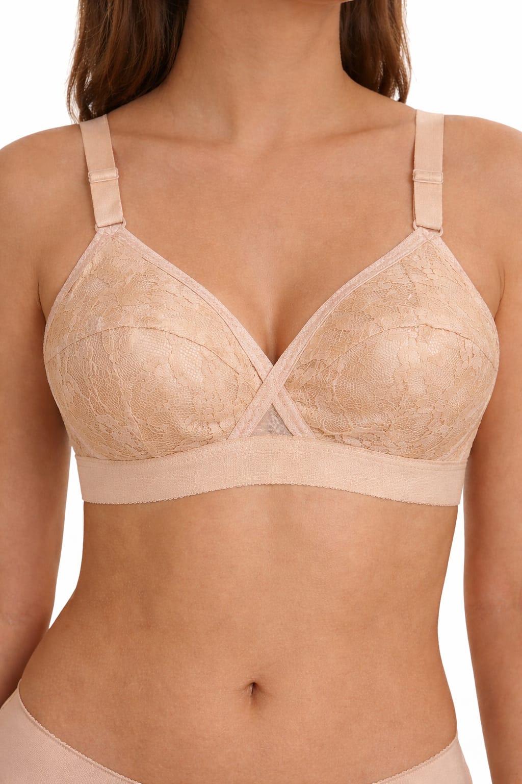Beige bra worn by a model on a white background