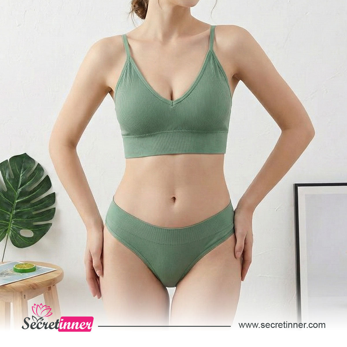 Woman wearing a green bikini set with a white background and Secret Inner logo.