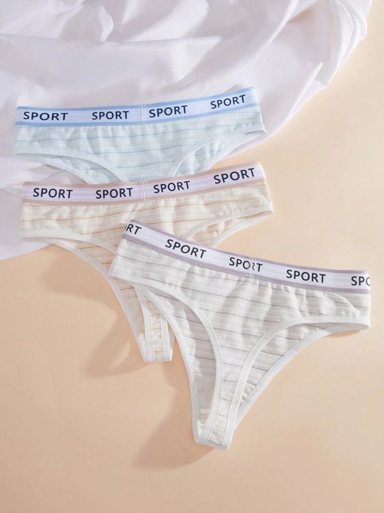 Two pairs of women's underwear with 'Sport' waistbands on a beige background