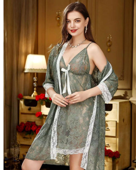 Woman wearing a green lace robe in a cozy room with warm lighting.