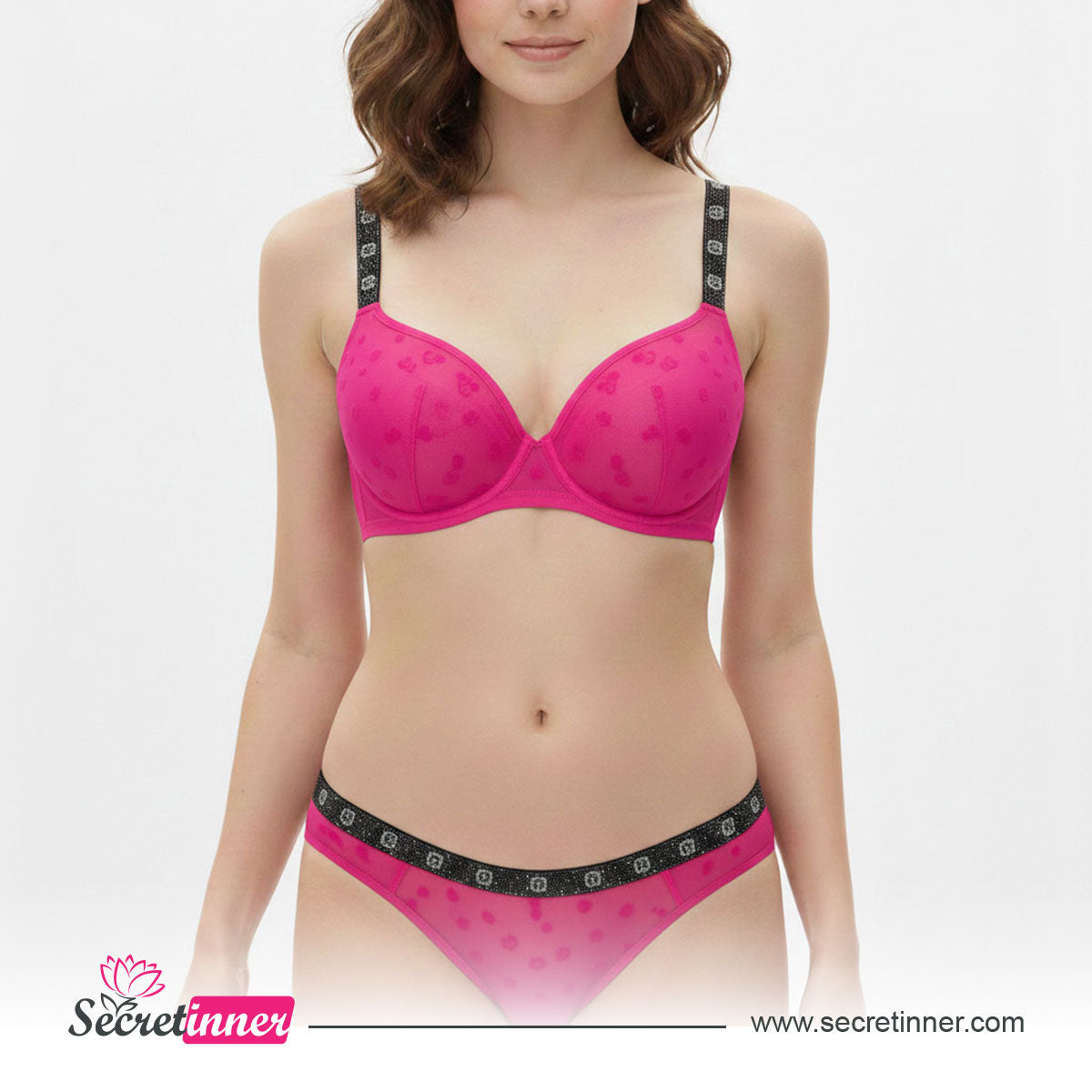 Woman wearing a pink bra and panties set with 'Secret Inner' branding on a white background.