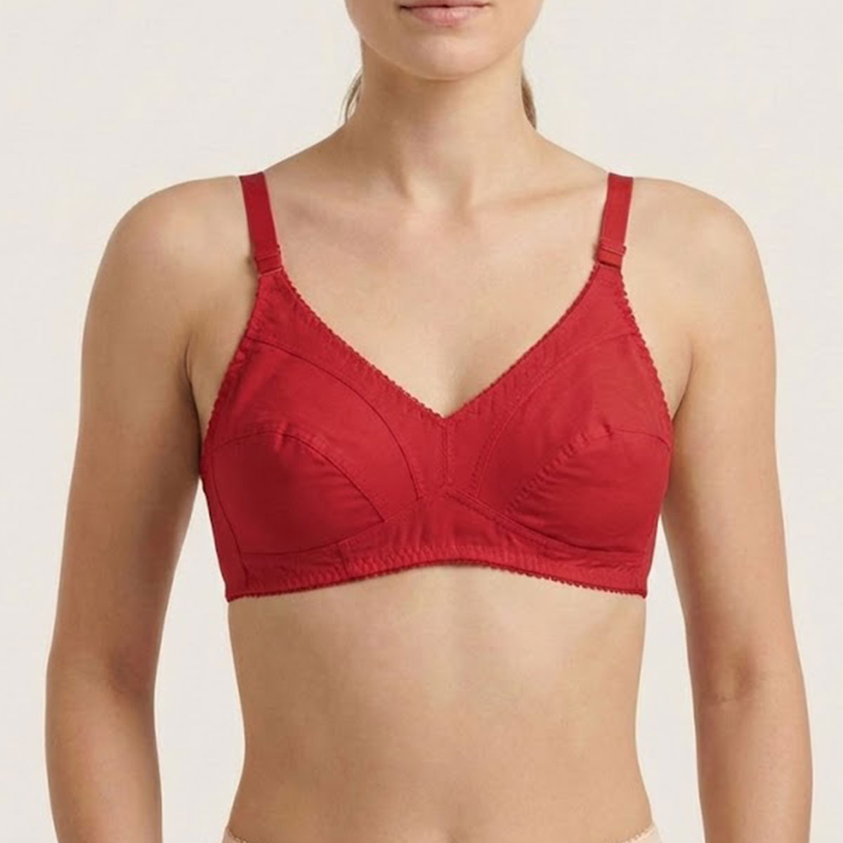 Red bra on a plain background