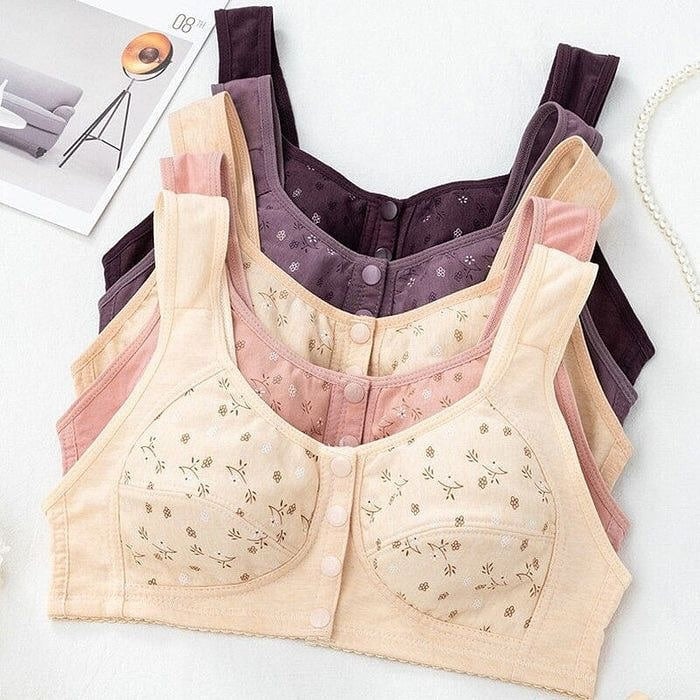 Beige and purple bras with floral patterns on a light gray background